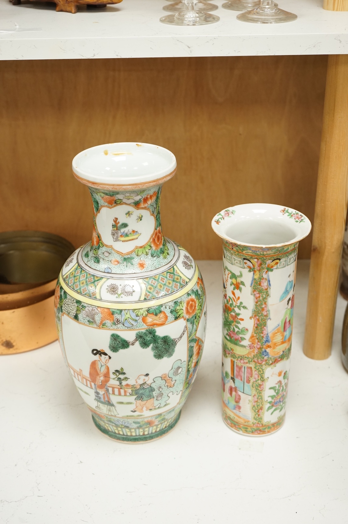 Two Chinese porcelain vases to include a famille rose sleeve vase and a larger famille verte vase, 36cm high